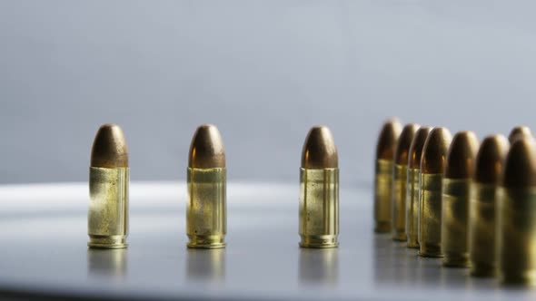 Cinematic rotating shot of bullets on a metallic surface - BULLETS 029