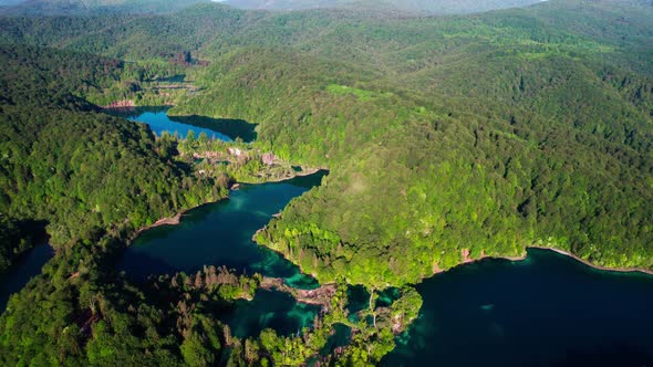 Cinematic Aerial View Of Plitvice Lakes Surrounded By Lush Green Forests In Croatia