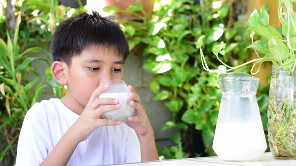 The Boy Drinking Some Milk.