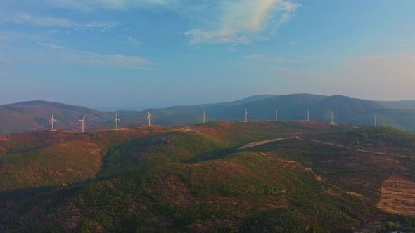 Drone Flies Over a Windmill Park