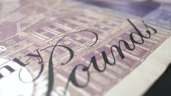 Fifty British Pound Paper Banknote in Close Up Macro View Dolly Shot