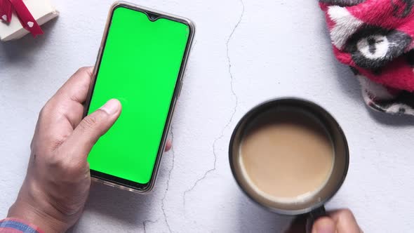 Using Smart Phone with Green Screen and Drinking Coffee 