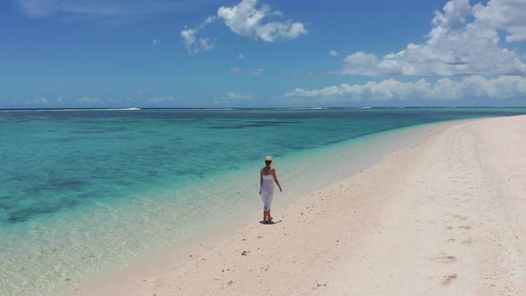 Girl Walking on a White Sand Beach on a Tropical Island in the Mauritius Indian Ocean