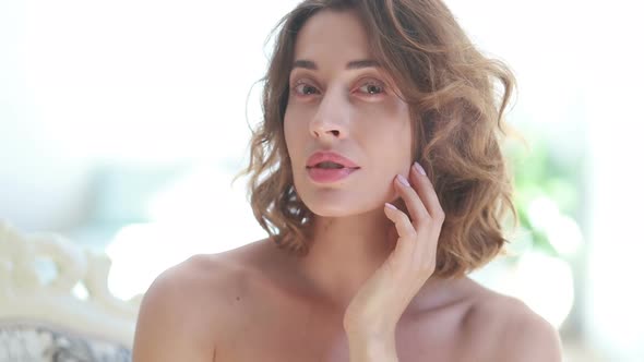 Close-up beauty portrait of young woman with smooth healthy skin