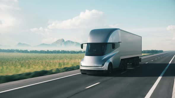 Semi-Truck With Cargo Trailer Moving on a Highway