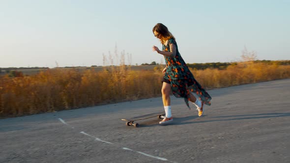 Longboarding Tricks By a Young Woman in a Dress, Outdoor Sports, 