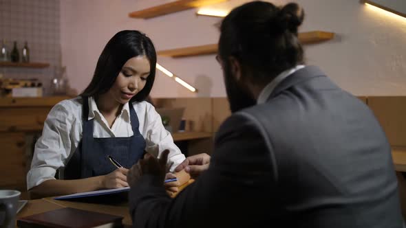 Friendly Entrepreneur Giving Assignments To Employee