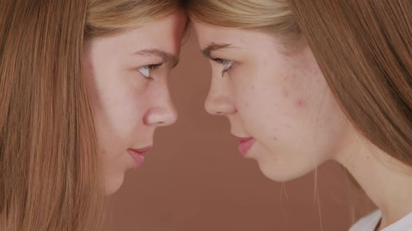 Close Up of Happy Twin Sisters