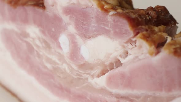 Tilting on smoked pork meat product layers  close-up 4K 2160p 30fps UltraHD footage - Shallow DOF cu