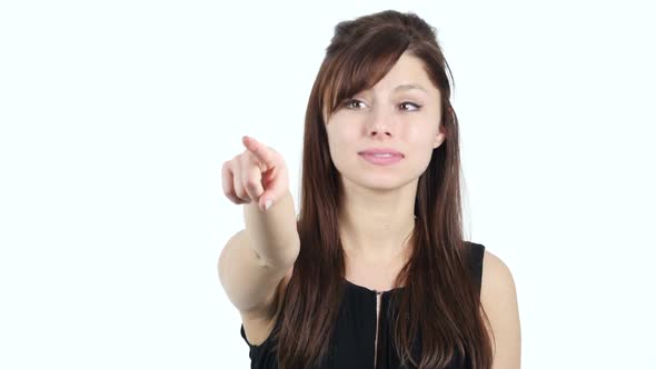 Young Girl Pointing at Camera, White Background