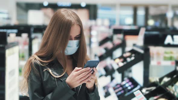 Young Cute Beautiful Woman in Protective Mask Takes Selfie