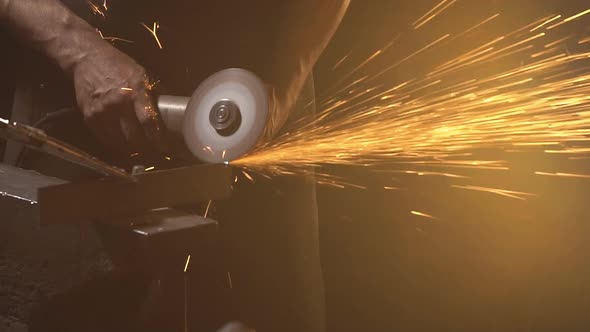 Sparks From Grinder Cutting Metal. Slow Motion