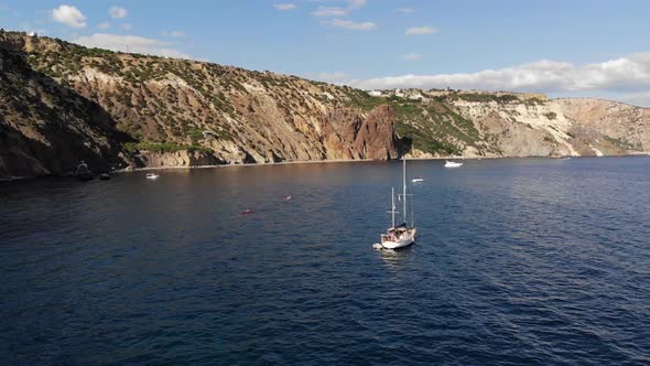 Aerial View Daytime Panoramic Scenic View of Drifting Sailing Yacht on Water Bay Surrounded By