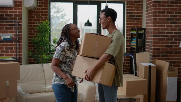 Portrait of Married Couple Holding House Keys and Cardboard Boxes