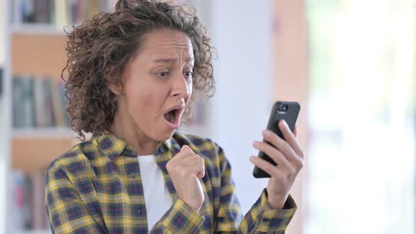 Portrait of Mixed Race Woman Loss on Smartphone