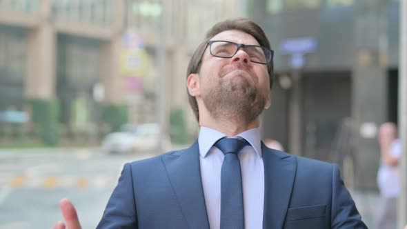 Portrait of Upset Businessman Reacting to Failure, Outdoor