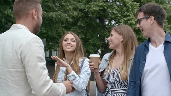 Friends Talking and Laughing while Walking Together