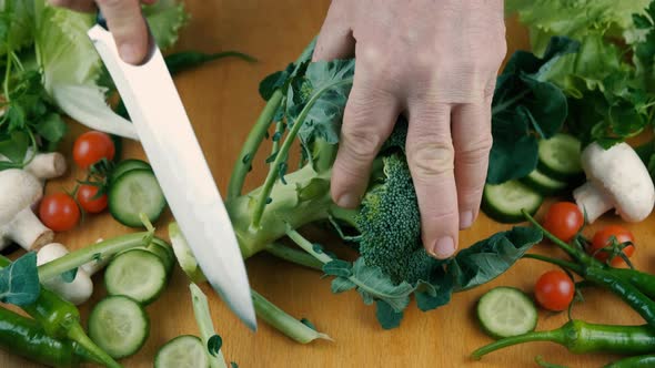 Close Up Knife Cutting Fresh Green Broccoli