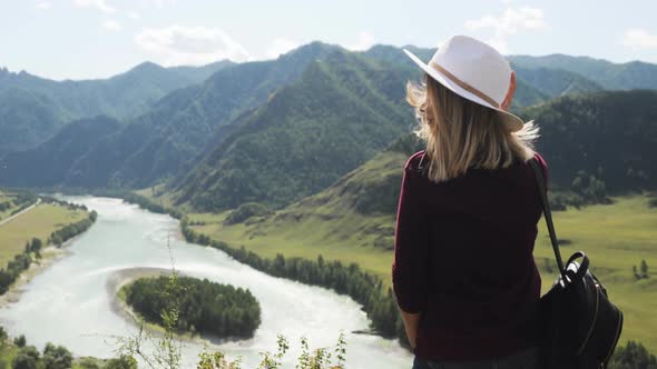 Woman Hiker Admiring Picturesque Nature View in Mountains Valley with River