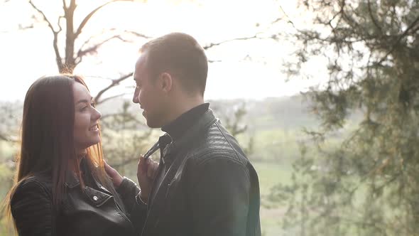 Loving Young Couple Kissing in the Park They are Happy Together