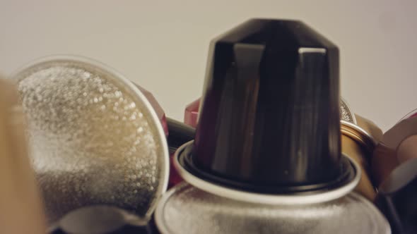 Macro shot of espresso capsules in various colors and flavors