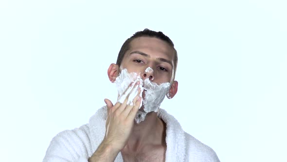 Guy Applying Shaving Foam. White Background. Slow Motion