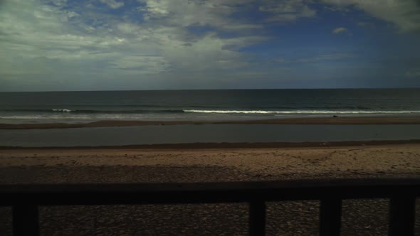 Looking at the sea and the clouds from the beach. (Slowmotion - Angle 005)