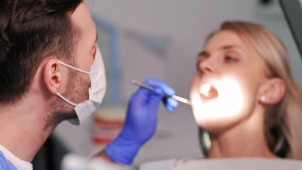Busy dentist during a very important dental treatment