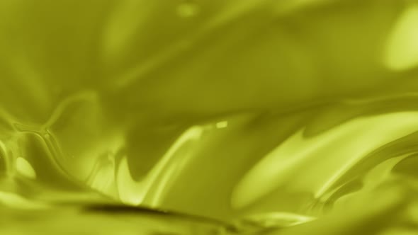 Super Slow Motion Shot of Swirling Green Olive Oil at 1000Fps.