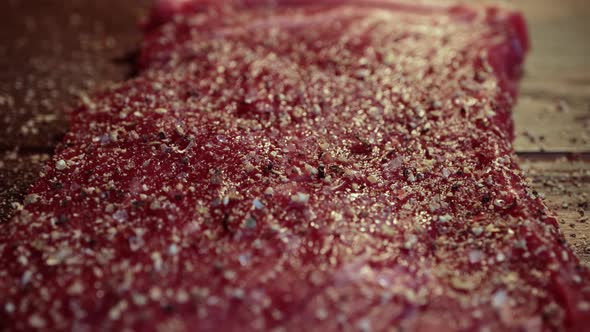 Mixed Pepper and Spices on the Raw Meat Steak