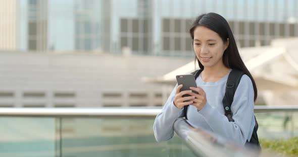 Woman use of mobile phone at outdoor