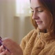 Young Woman Sitting on Living Room Scrolling Content Bloggs - VideoHive Item for Sale