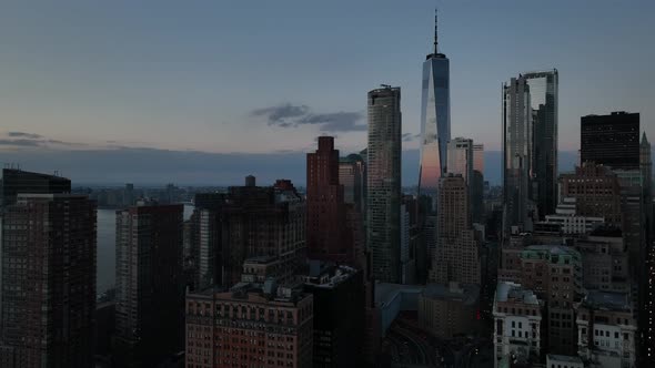 An aerial view of lower Manhattan, NY on a beautiful evening just before sunset. The drone camera, l