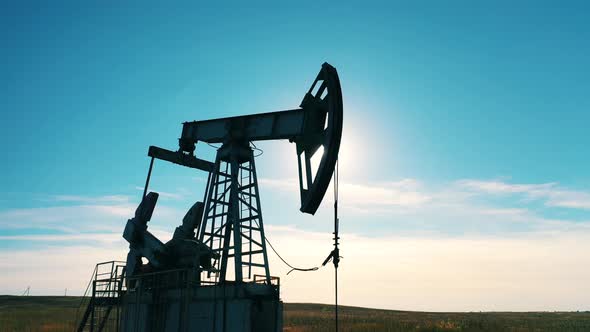 Silhouette of a Working Oil Pump Jack