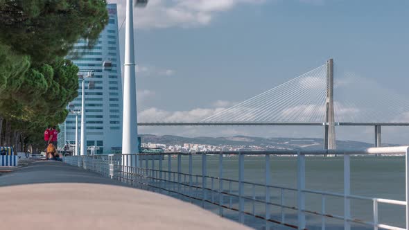 View From River Tagus Waterfront of Lisbon's Nations Park and Vasco Da Gama Bridge Timelapse