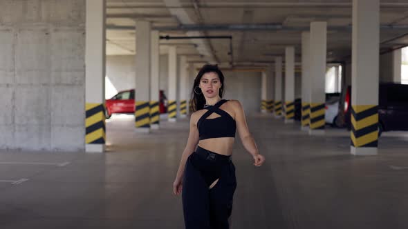 Dancing Woman Performs Modern Dance Posing Slow Moves in Parking Zone