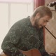 Adult Musician Playing Guitar at Home - VideoHive Item for Sale