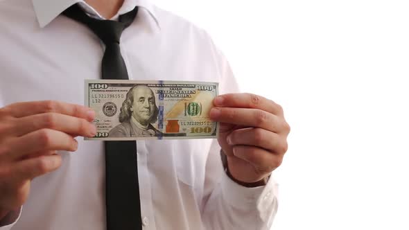 A Man In A White Shirt Waves Dollars. Shows Money. Businessman Made A Lot Of Money