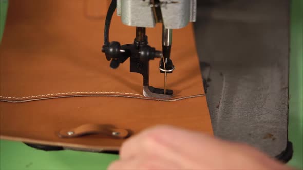 Close Up Shot of the Master Hands, Who Sews the Leather Product in the Factory