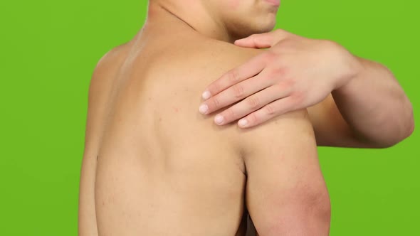 Man Suffering From Having Cramps in Shoulder, Severe Pain. Closeup