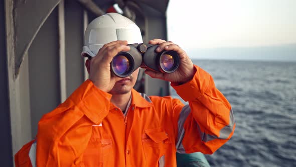 Filipino Deck Officer on Deck of Vessel or Ship , Wearing PPE Personal Protective Equipment