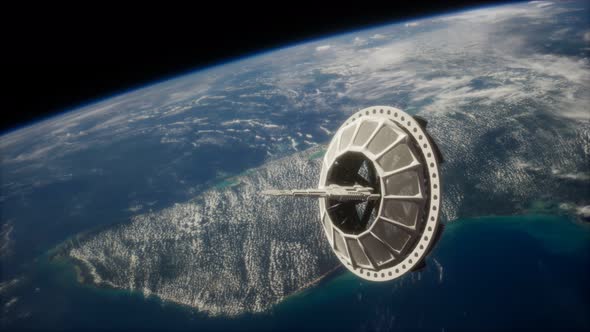 Futuristic Space Satellite Orbiting the Earth alt