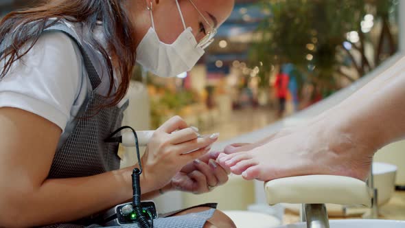 The Beautician Performs the Procedure Prepares and Processes the Client's Nail with a Special