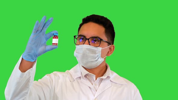 Virologist Shows a Developed COVID19 Vaccine on a Green Screen Chroma Key