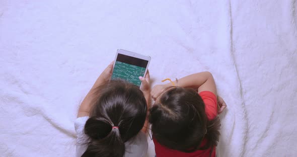 Little Girls Using Tablet With Math