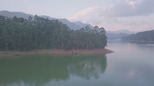 Aerial drone view of lake in Western Ghats mountains of Munnar, India