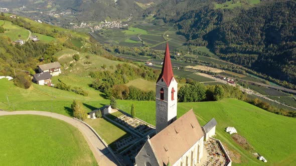 A Bird's-eye View of the Church and the Valley Near the Village of Velturno. Dolomites. Autumn Italy