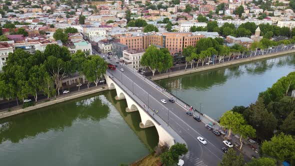 Fly Over The Bridge In The Evening City