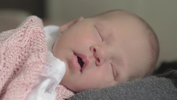 Lovely Newborn Baby Girl Sleeping on Mothers Chest