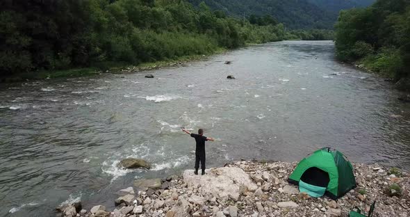 The Man Demonstrates a Sense of Freedom Arms Outstretched